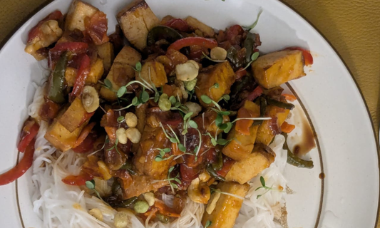 Sticky smoked tofu glazed with marmalade and gochujang, served with noodles and mixed microgreens.