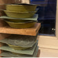 Cardboard germination cover placed over microgreen seeds during sprouting