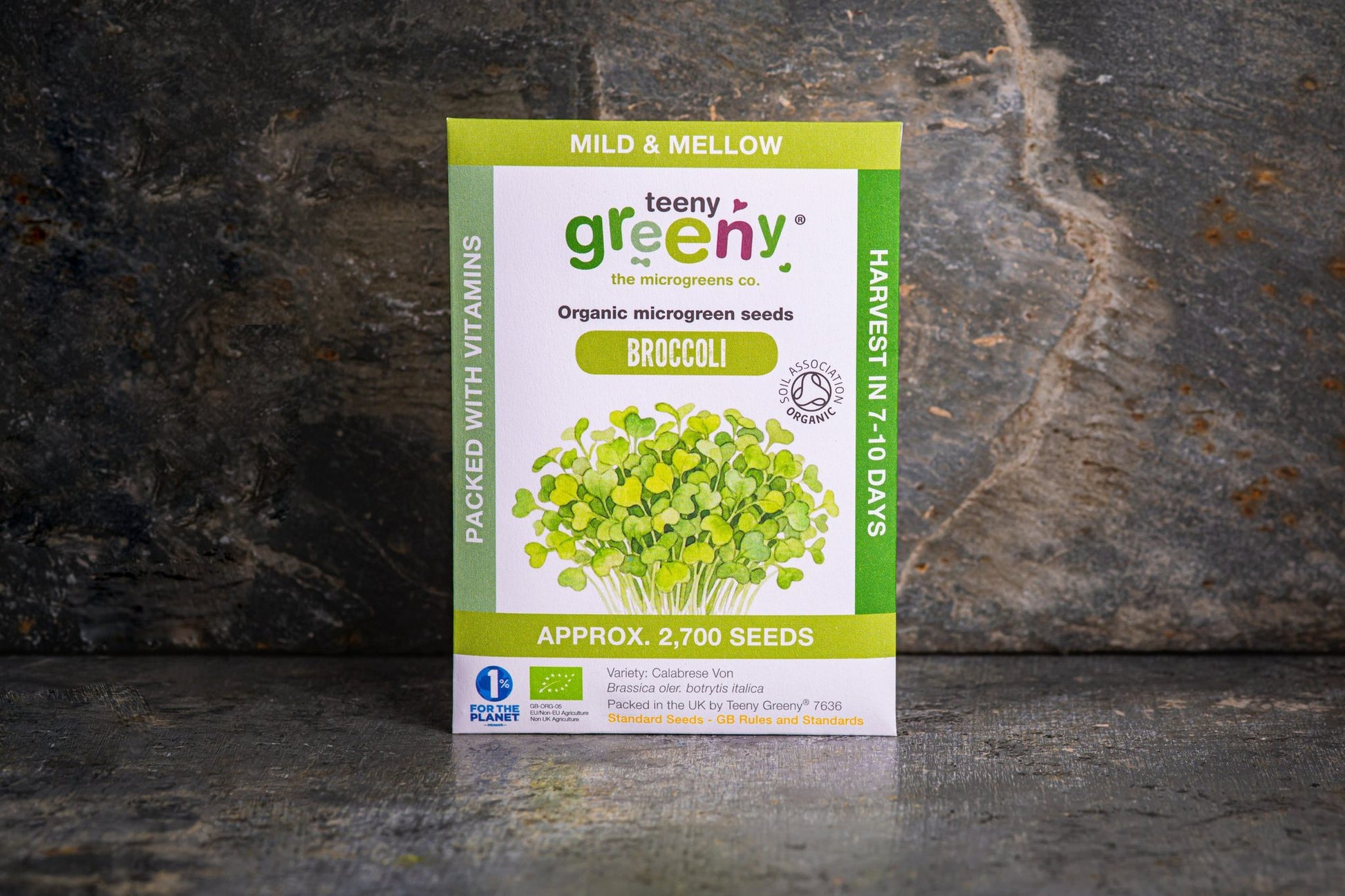 Teeny Greeny organic Broccoli microgreen seed packet standing upright on dark slate background
