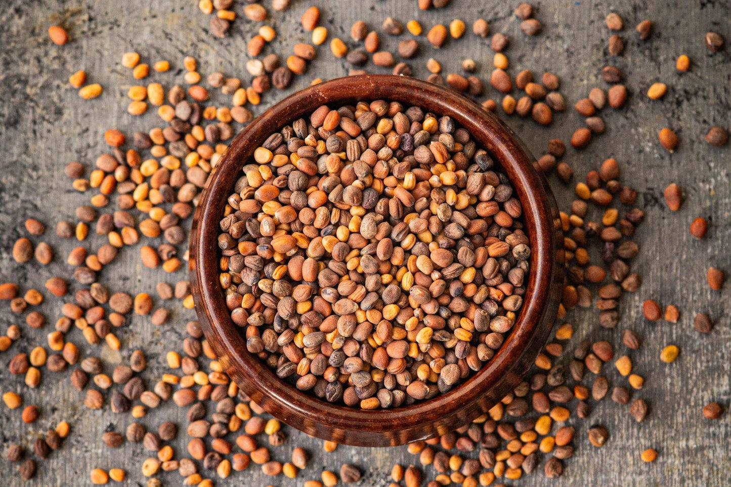 Teeny Greeny organic mixed radish microgreen seeds close up showing variety mix in wooden bowl
