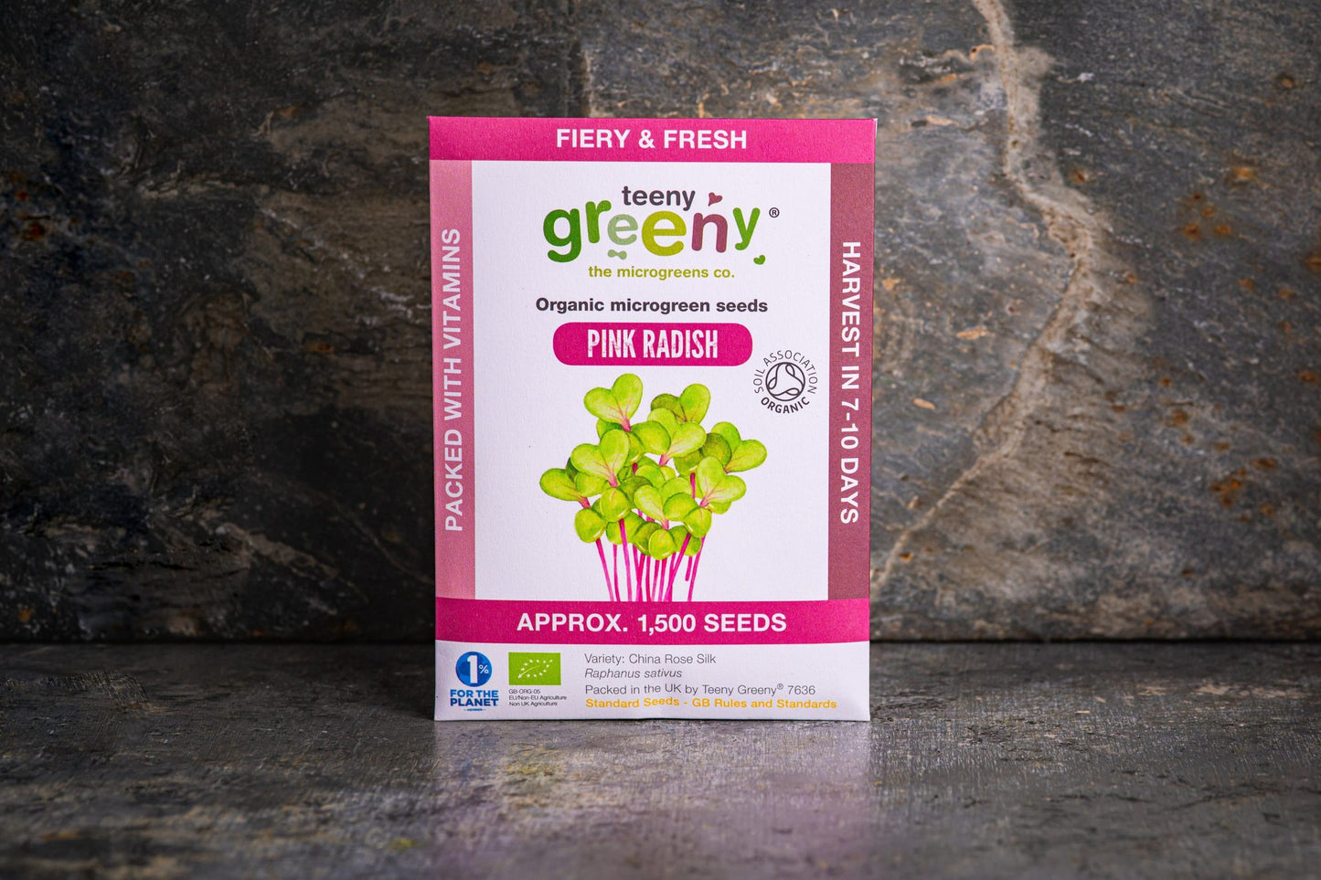 Teeny Greeny organic Pink Radish microgreen seed packet standing upright on dark slate background