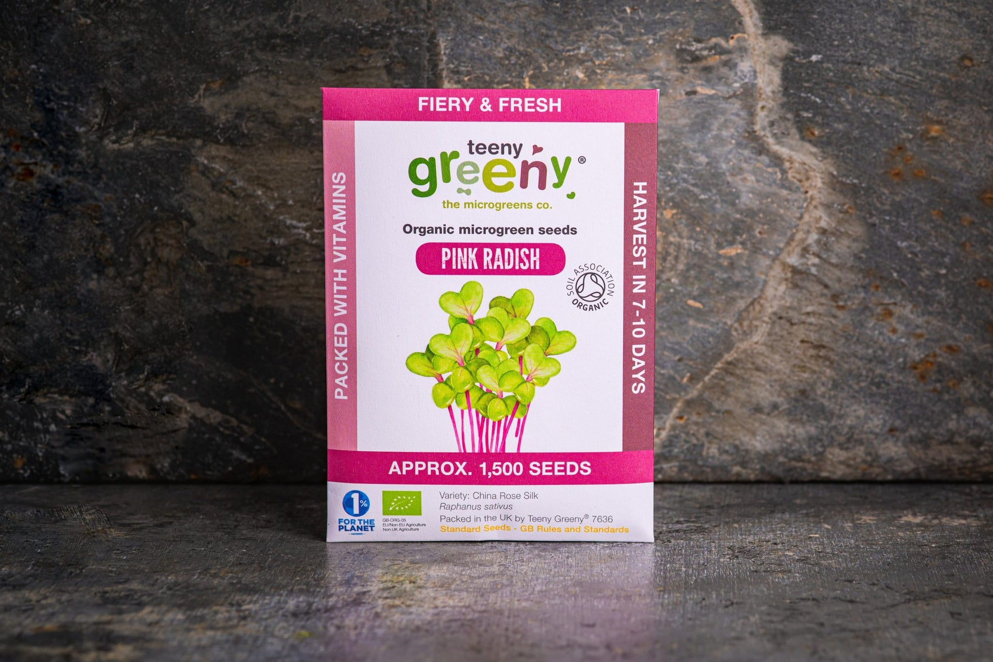 Teeny Greeny organic Pink Radish microgreen seed packet standing upright on dark slate background