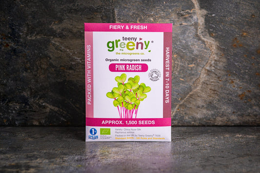 Teeny Greeny organic Pink Radish microgreen seed packet standing upright on dark slate background
