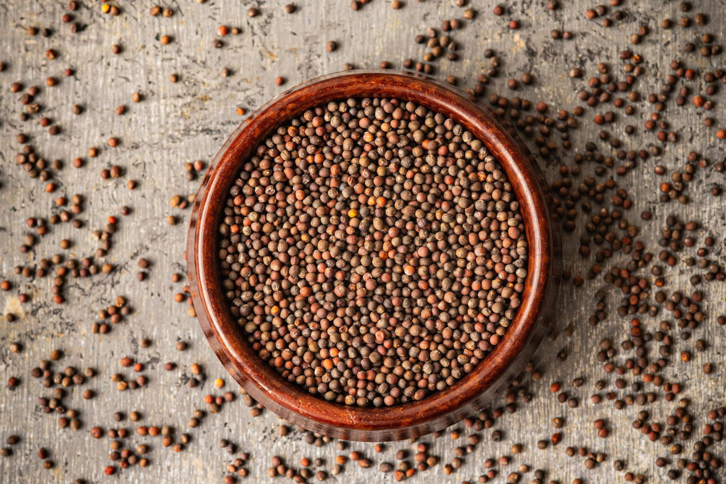 Teeny Greeny organic red cabbage microgreen seeds close up in wooden bowl
